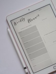 A weekly plan on a iPad screen also used to help with your checklist for relocation.