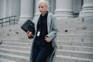 A business woman walking down the stairs