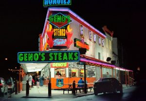 cars parked in front of a restaurant